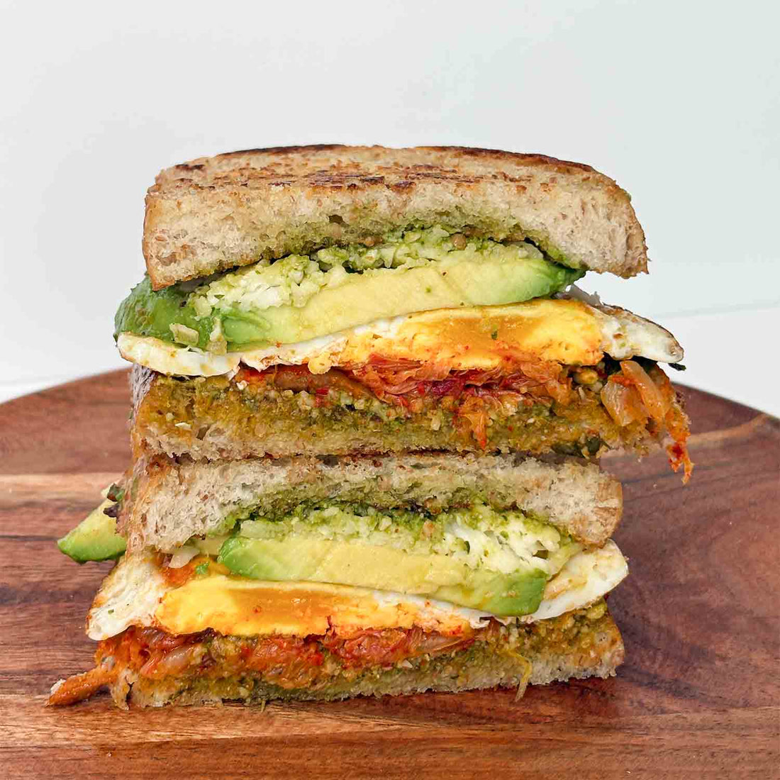 The Ultimate Kimchi Grilled Cheese Sandwich with Pesto, Avocado, and Egg